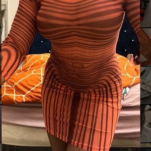 Camouflaging orange and black dress